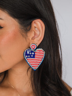 festive done right: heart on sleeve, flag on lobes.