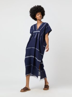 caftan that is handspun, handwoven, cut, and sewn by local artisans
