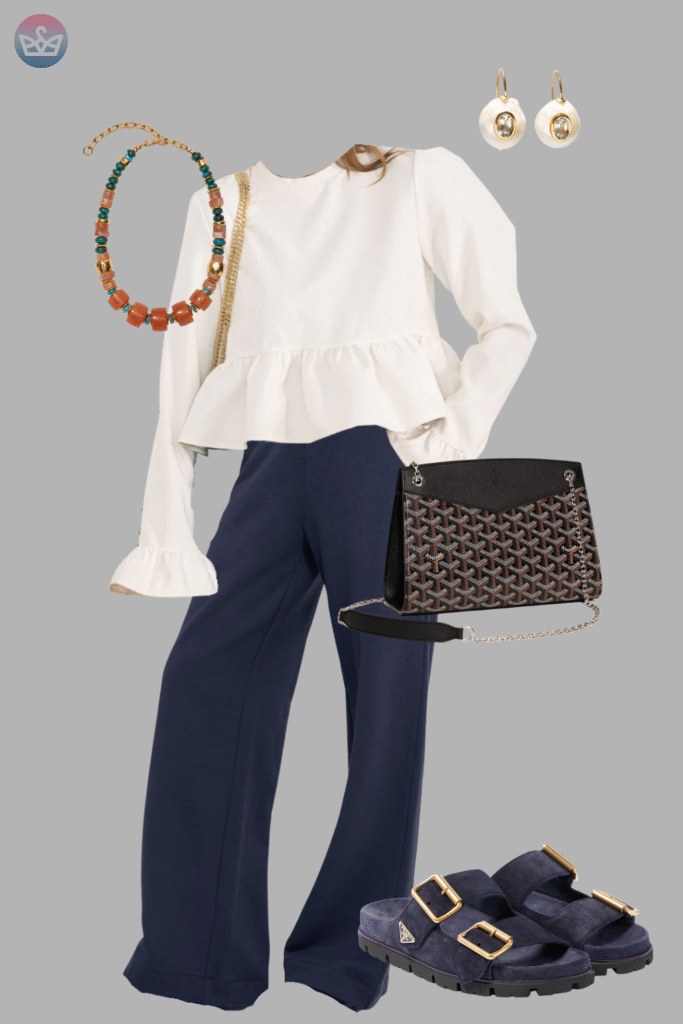 Modern and fresh how to style a white shirt like a pro 10 adjust my crown A relaxed outfit idea showing how to style a white shirt a simple white long sleeve top with navy blue wide leg trousers navy slide sandals a black handbag and a colorful beaded necklace