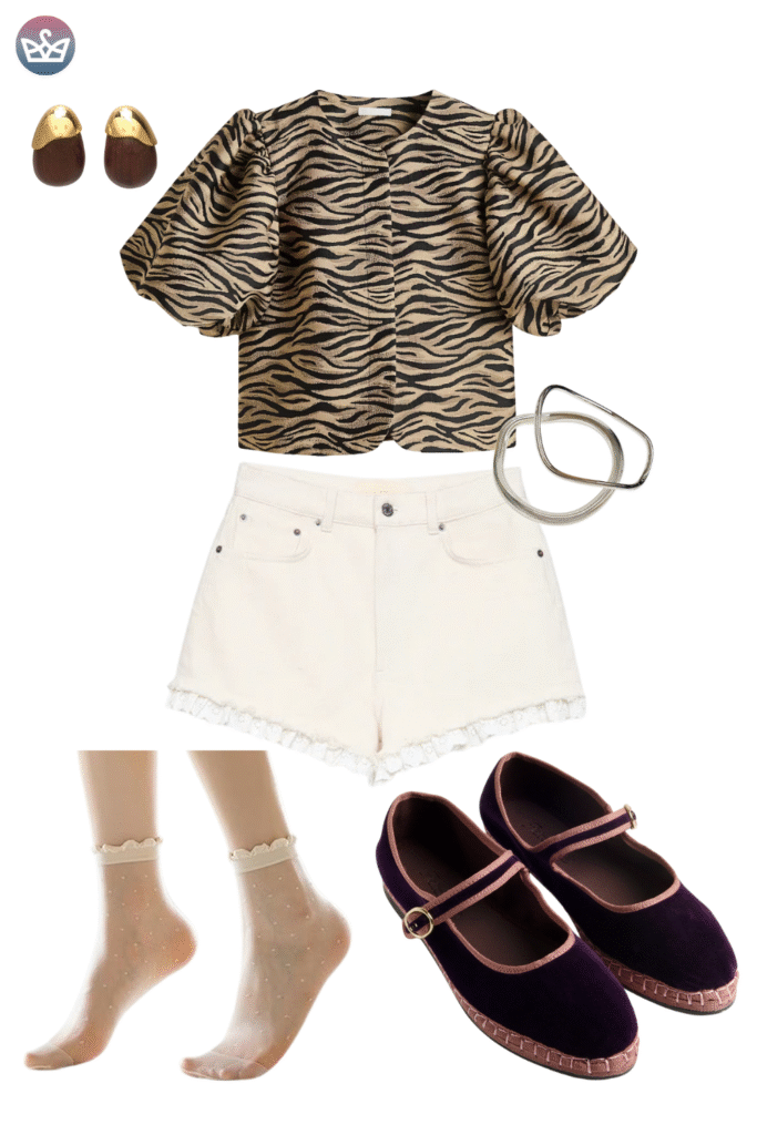 Statement making fall outfit featuring an on trend tiger print puff sleeve crop top high waisted white cutoff shorts with subtle lace trim and gold jewelry The key to this look is the charming dark velvet mary jane flats with rose gold trim proving stylish and comfortable footwear is essential for a fun casual fall look