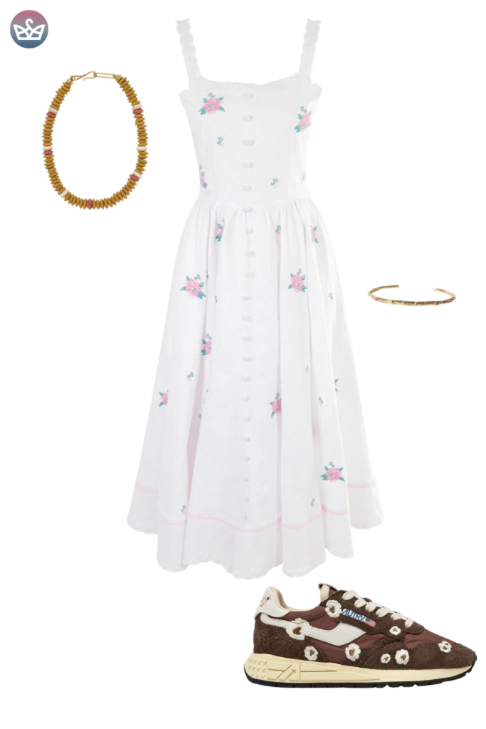 Elegant white fall outfit with a delicate pink and green floral embroidered midi dress a chunky gold bead necklace and a simple gold bracelet Styled with brown floral sneakers and thin socksstockings highlighting comfortable yet stylish footwear for a chic autumn day