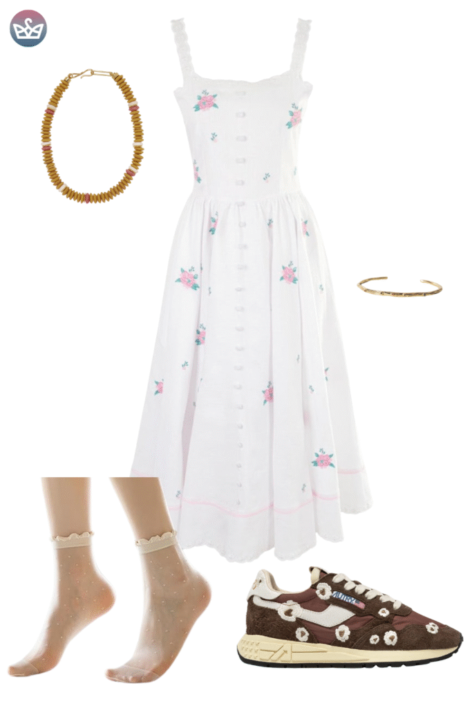 Elegant white fall outfit with a delicate pink and green floral embroidered midi dress a chunky gold bead necklace and a simple gold bracelet Styled with brown floral sneakers and thin socksstockings highlighting comfortable yet stylish footwear for a chic autumn day