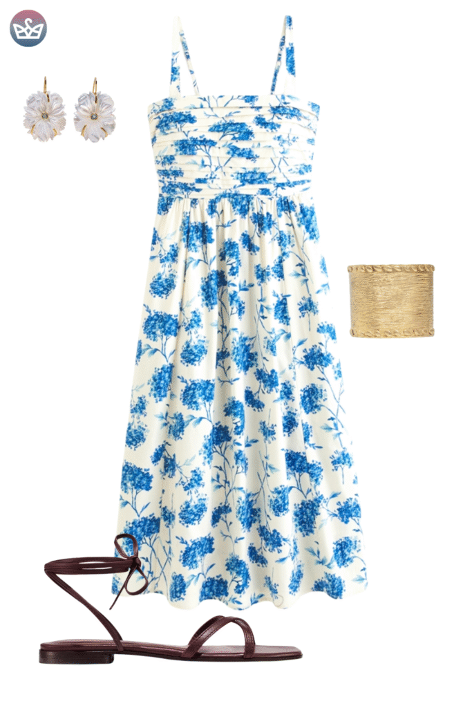 Gorgeous early fall outfit featuring a blue and white large floral print maxi sundress styled with gold cuff bracelets and white floral drop earrings The look is grounded with simple elegant dark leather ankle tie sandals A late season choice focusing on comfortable flat footwear before the weather turns too cool