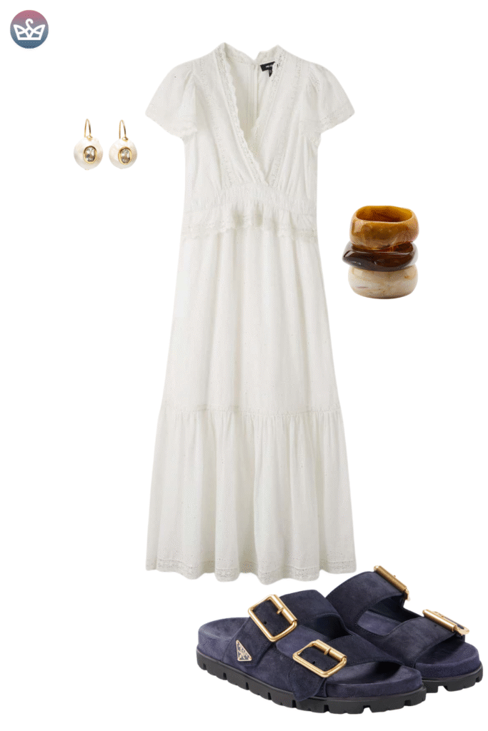 Flowy and elegant early fall outfit featuring a beautiful white tiered wrap maxi dress simple gold hoop earrings and stacked brown bangle bracelets The dress is styled with comfortable dark navy suede double strap sandals This look focuses on how easy walkable footwear can be styled for a comfortable yet fashionable autumn transition even with the addition of cozy socks