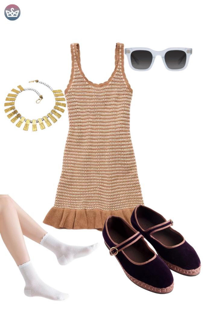 Effortlessly chic fall outfit featuring a ribbed camel colored knit mini dress with a ruffled hem oversized white sunglasses and a chunky gold statement necklace The look is grounded with trendy dark velvet mary jane flats with rose gold trim highlighting a polished footwear choice for transitional autumn weather