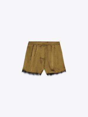 Hear me out: satin lace-hem shorts (possibly over opaque tights, but definitely with boots for weather purposes) with a black cashmere turtleneck. The knit blouses slightly (don’t force a tuck), the shorts’ soft waistband sits easy, and the lace edge is the distraction. 

Cozy bonus: you probably have a black turtleneck in your closet and it works for all fall outfits—from Thanksgiving with suede pull-ons to study days with heather-grey sweats.