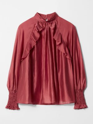 A dark red frilled blouse adds drama; A-line swish through the body means your plate can be generous. Wear with those same vegan-suede pull-ons or wide-leg denim for volume balance and comfort.

Tip: The ruffles and gathered neckline are forgiving—shop your closet for sturdy, non-cling fabrics cut with gathers and ruffles.