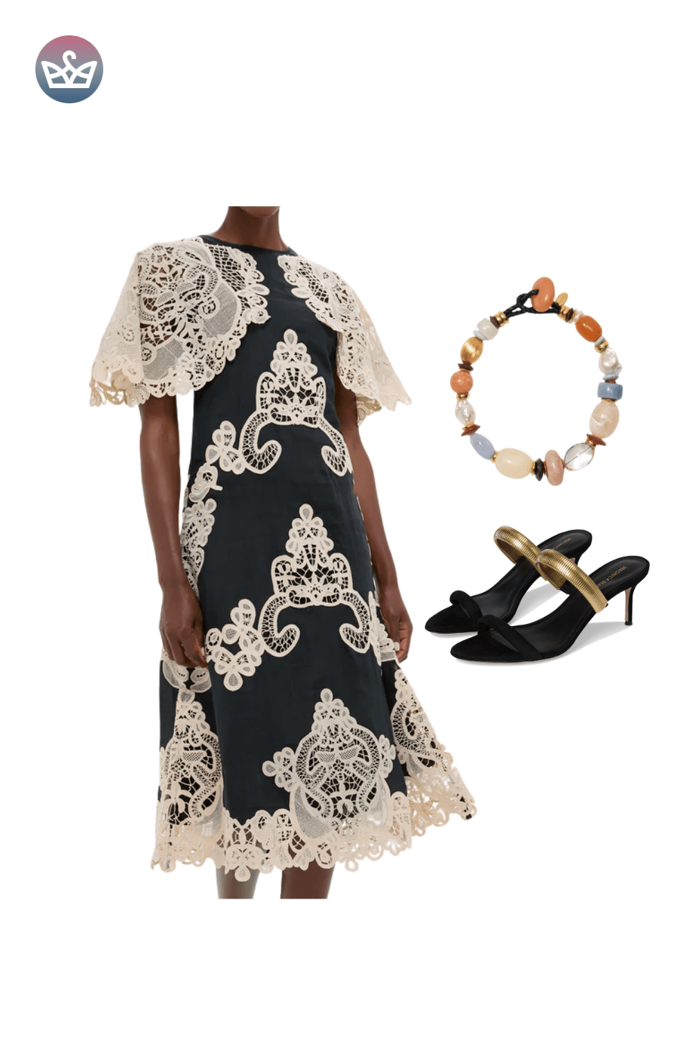 Black and cream lace maxi dress with a sheer cape overlay, styled with a floral headpiece and black strappy heels.