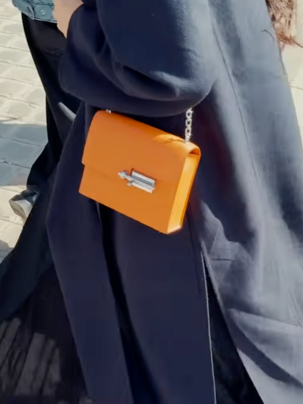 When does a neutral outfit look better with a bright bag Your outfit is fine Its not bad Its just neutral and somehow it feels invisible Youve tried adding a scarf switching your shoes layering a cardigan Nothing lands The problem isnt your clothes Its visual math Your outfit doesnt have an exclamation point   the