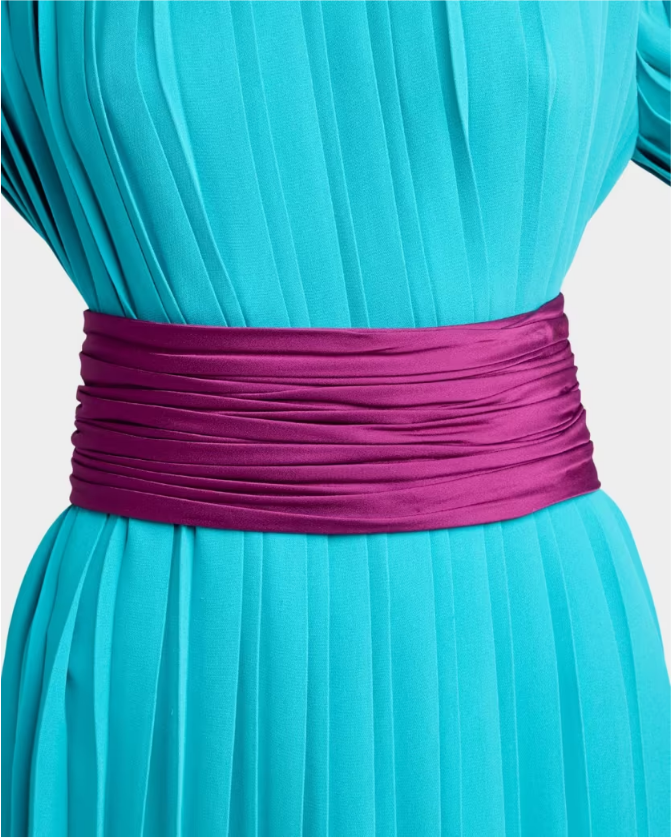 Close up of a turquoise pleated dress cinched with a magenta satin belt at the waist Tldr yes you can repeat a winter wedding guest dress In one poll 71 of adults said they wouldnt notice The more of the same guests the more you change Swap the belt shoes and earrings and top your winter wedding guest outfit with velvet or satin Poll two looks crown the winner and note  adjust my crown